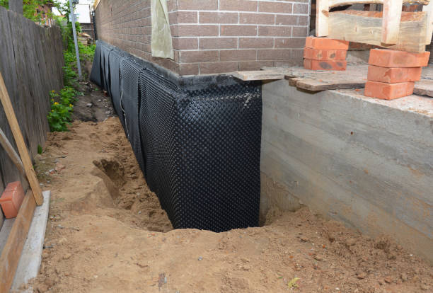 Happy homeowners after waterproofing job in Lewiston